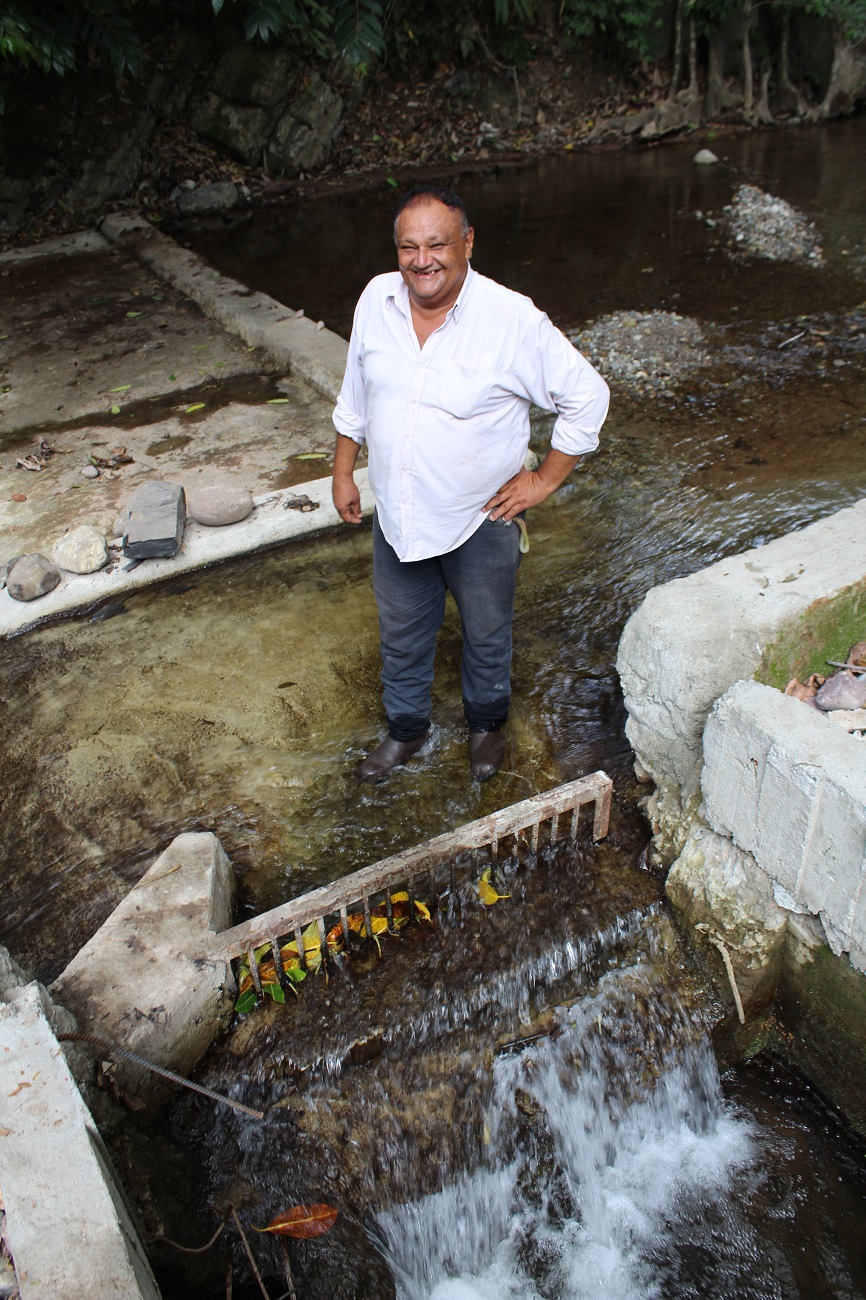 Community leader Reginaldo Peralta, happy with the new dam on the San Antonio river.