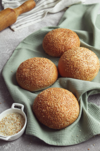 bread rolls with sesame seeds on top