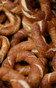 a pile of sesame seed bagels